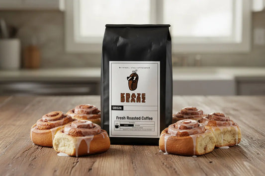 Kraze Beanz Cinnabun Black coffee bag with a logo on  label on a kitchen background with cinnabuns