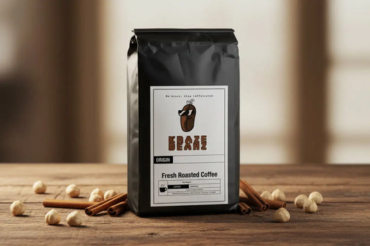 Kraze Beanz Cinnamon Hazelnut Black coffee bag with a logo on label on a table background